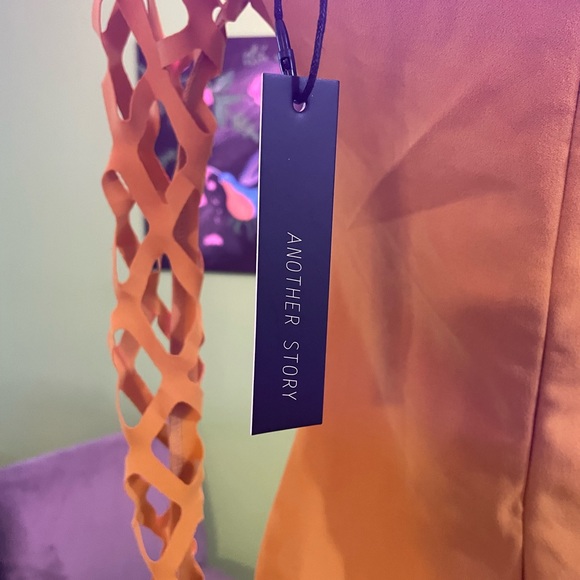 Brand: Another Story
Product: Fitted Mini Dress w/Diamond Peek-A-Boo Sleeves - Picture 4 of 11